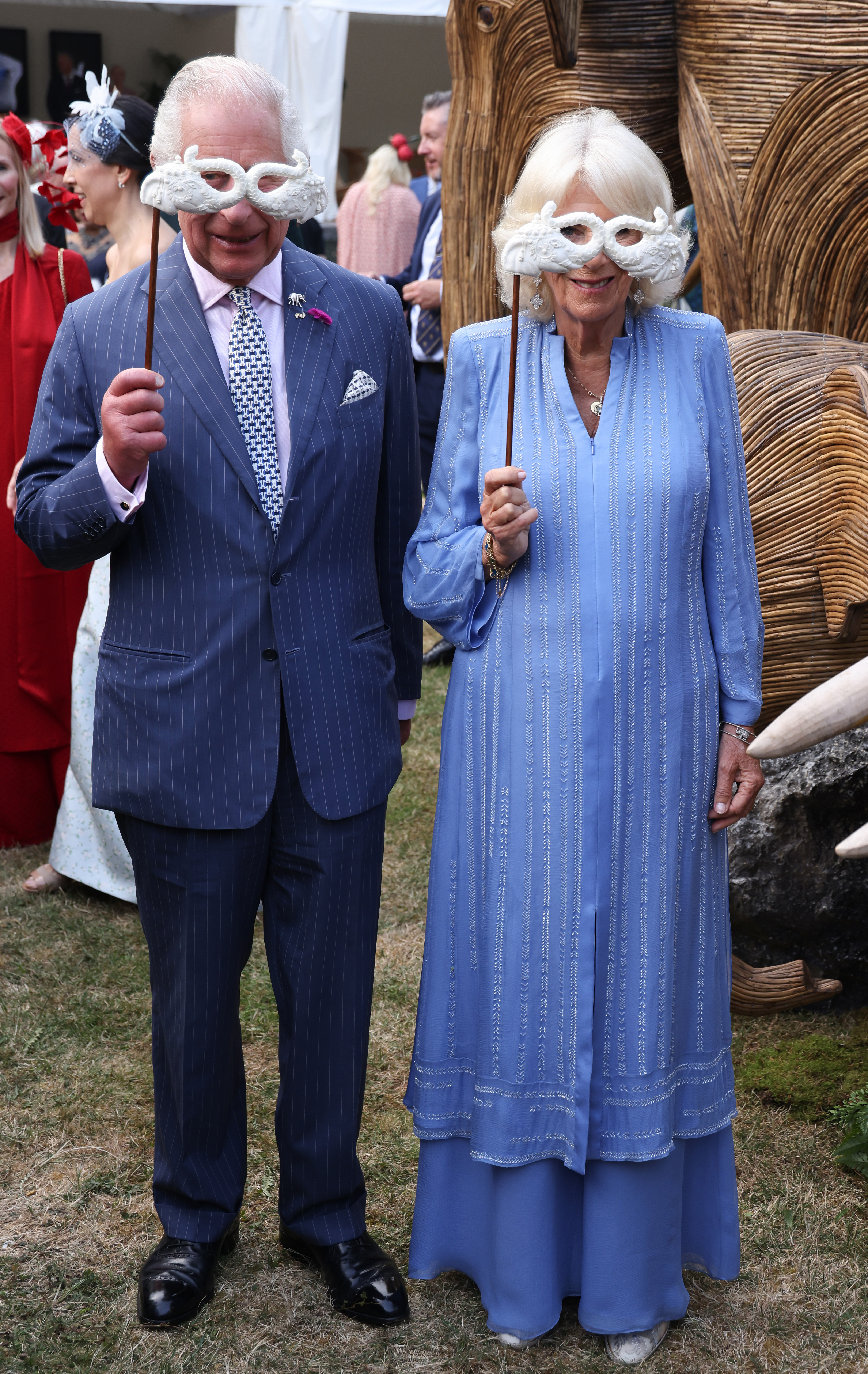 His Majesty and Her Majesty with masks at the Animal Ball